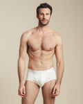 man wearing white mid rise cotton brief