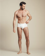 man wearing white mid rise cotton brief