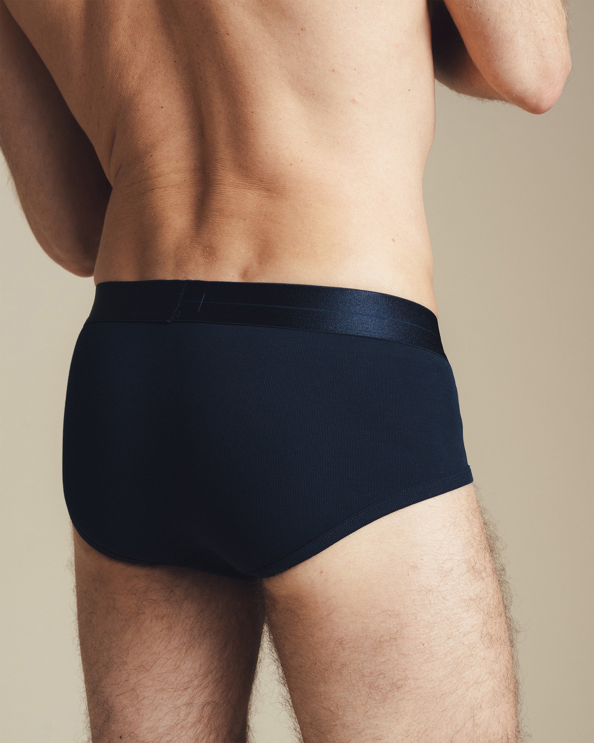 Man wearing a navy underwear brief